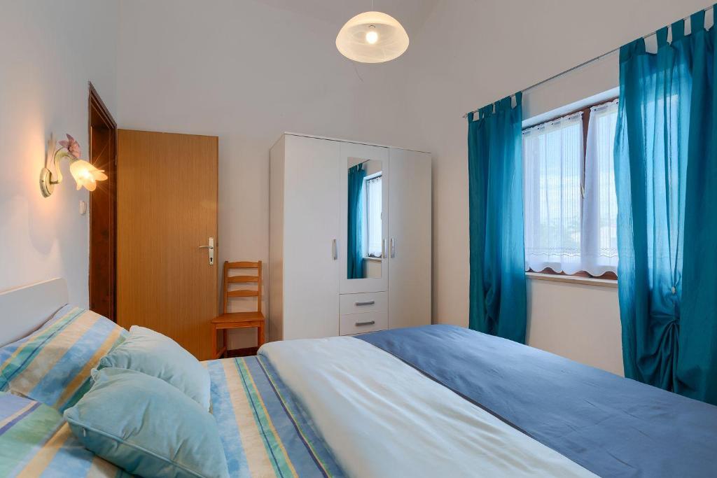 Łóżko lub łóżka w pokoju w obiekcie Komplett umzäuntes Ferienhaus mit Klima, WLAN