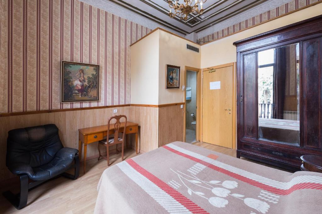 Postel nebo postele na pokoji v ubytování Pensión Villanueva