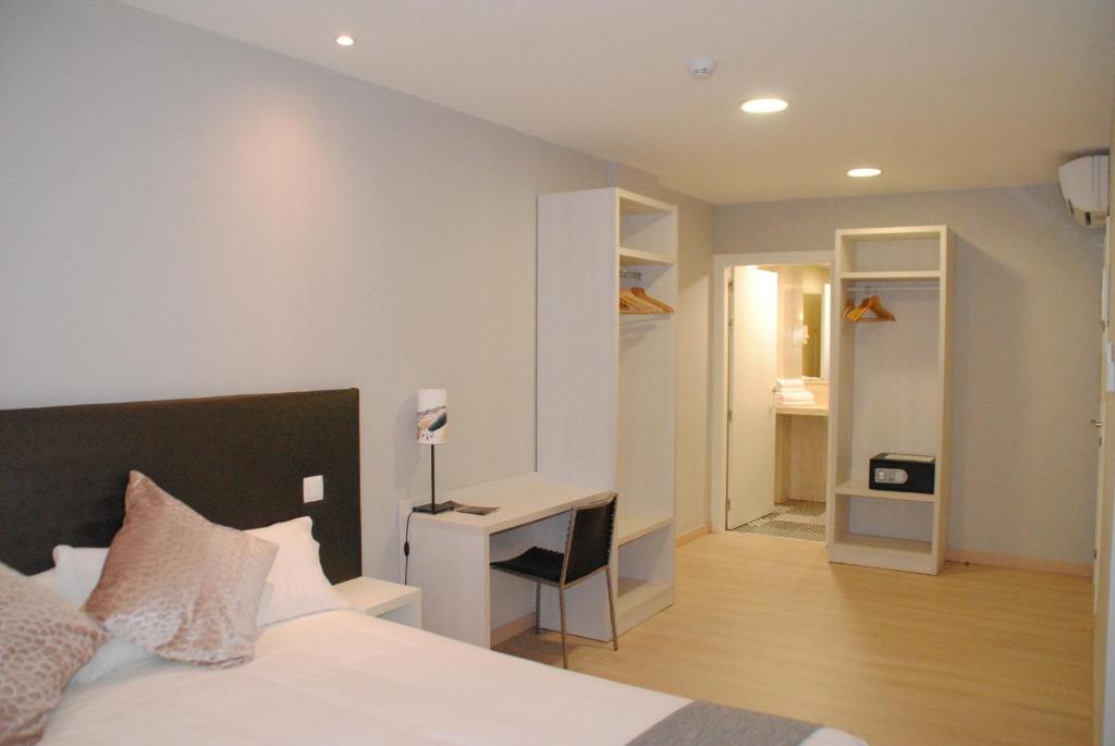Postel nebo postele na pokoji v ubytování Hostal Aslyp 114