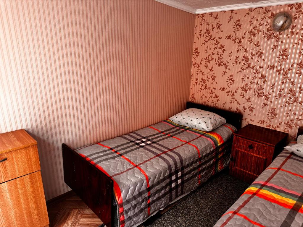 Postel nebo postele na pokoji v ubytování Helena guest house