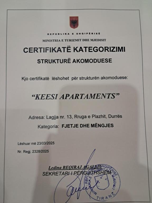 a white envelope with a piece of paper at Apartments Keesi 2 in Durrës