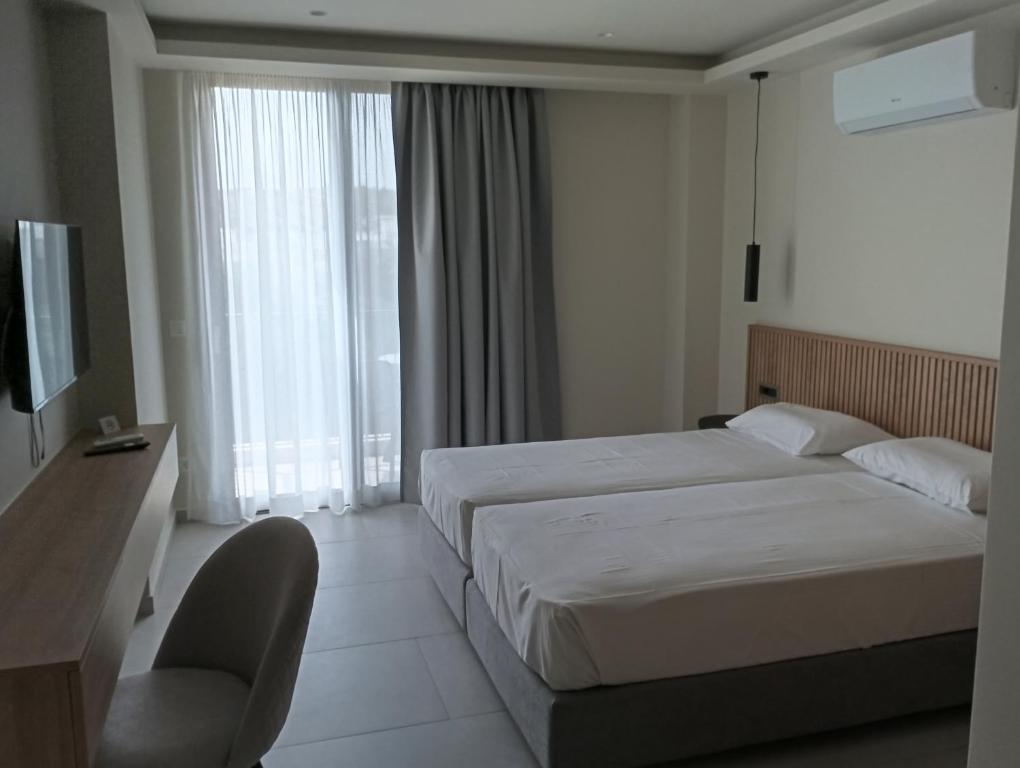 Postel nebo postele na pokoji v ubytování Lena Apartments