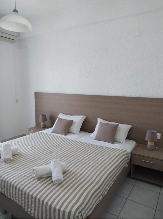 Postel nebo postele na pokoji v ubytování Lena Apartments