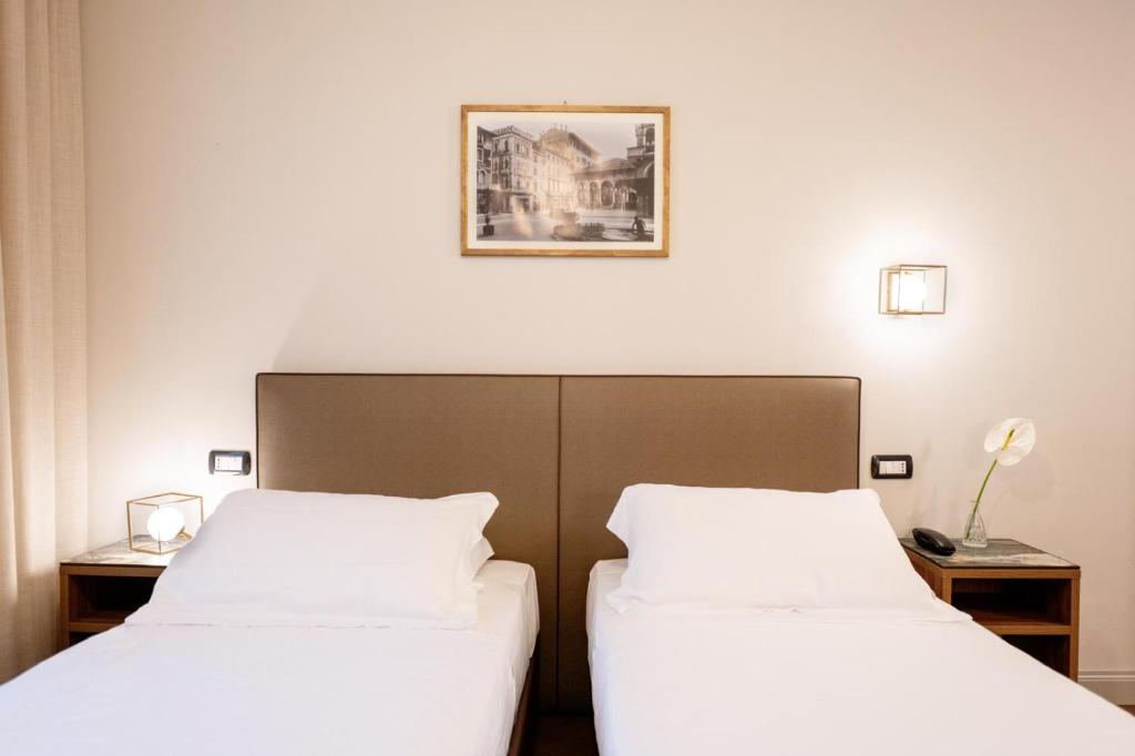 Postel nebo postele na pokoji v ubytování Porta Altinia Suites