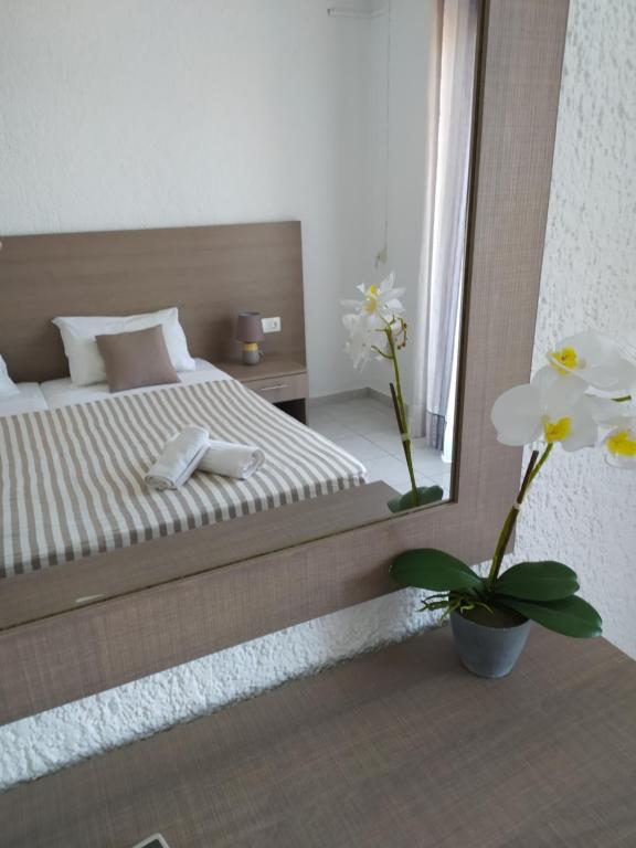 Postel nebo postele na pokoji v ubytování Lena Apartments