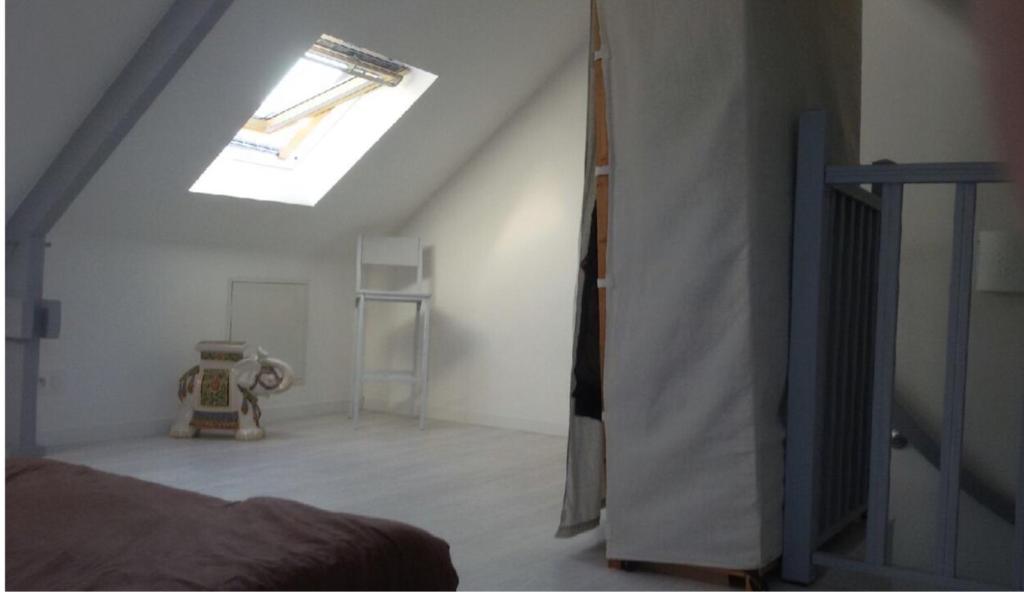 Ένα ή περισσότερα κρεβάτια σε δωμάτιο στο Appartement centre bourg