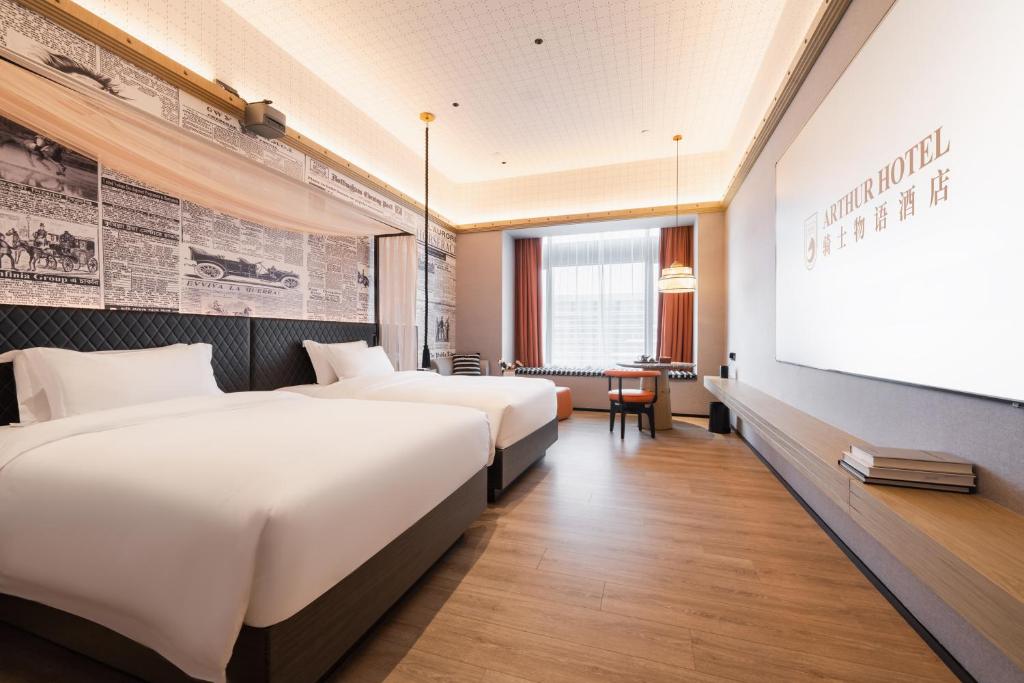 Postel nebo postele na pokoji v ubytování Arthur Hotel Liwan COCO Park Guangzhou-24H Coffee&Low Tea & Free Shuttle Bus For Canton Fair By Paco Group