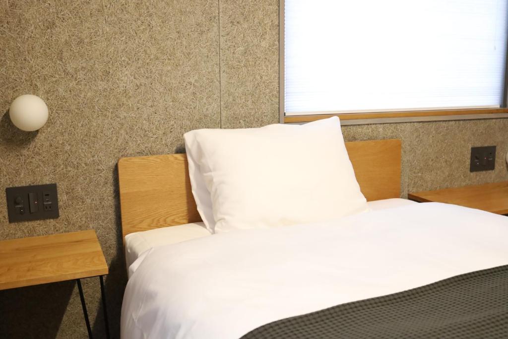 Postel nebo postele na pokoji v ubytování cafe&hostel TMC