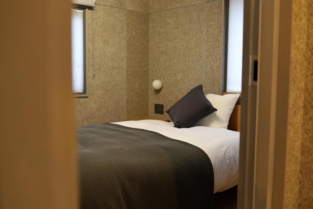 Postel nebo postele na pokoji v ubytování cafe&hostel TMC