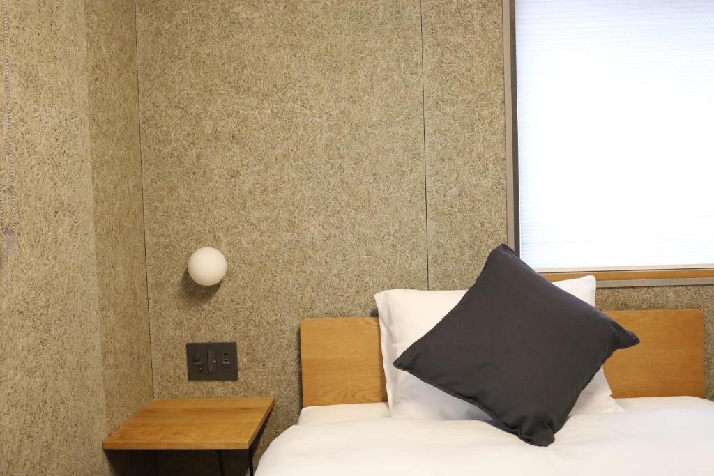 Postel nebo postele na pokoji v ubytování cafe&hostel TMC