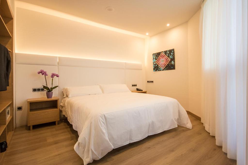 Postel nebo postele na pokoji v ubytování Hotel Palacio de Aiete