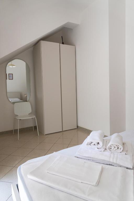 Łóżko lub łóżka w pokoju w obiekcie Dainese Apartments, Casa Abigail
