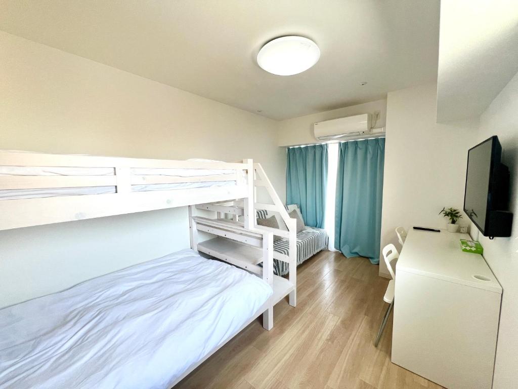 Postel nebo postele na pokoji v ubytování Suke Home Oshiage
