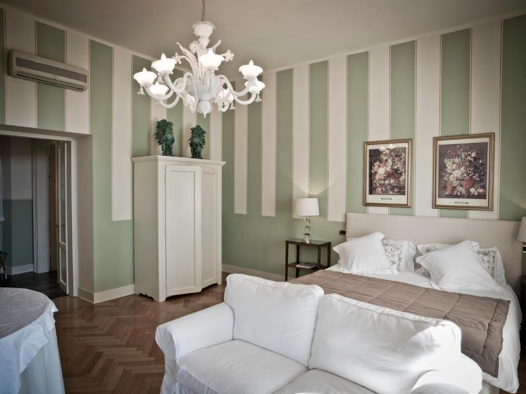 Postel nebo postele na pokoji v ubytování Residenza Borgo 27