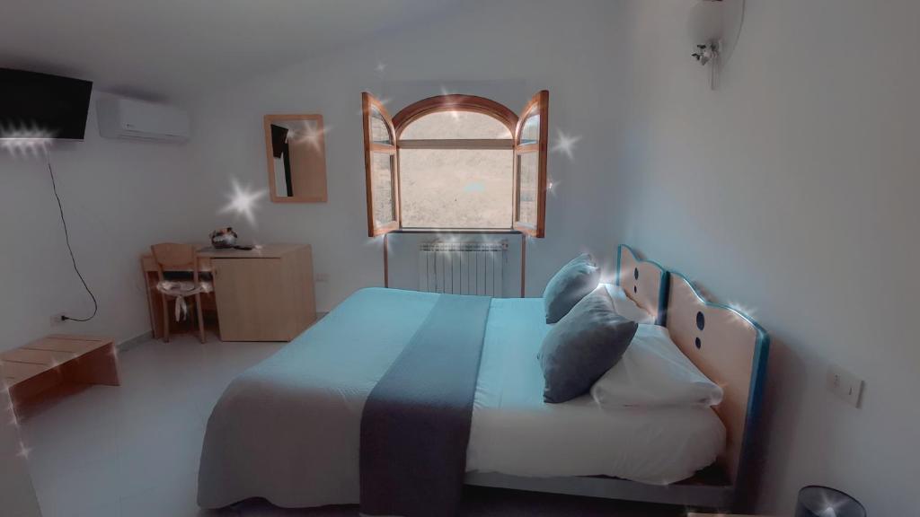 Postel nebo postele na pokoji v ubytování Hotel affittacamere novella