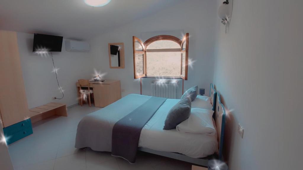 Postel nebo postele na pokoji v ubytování Hotel affittacamere novella