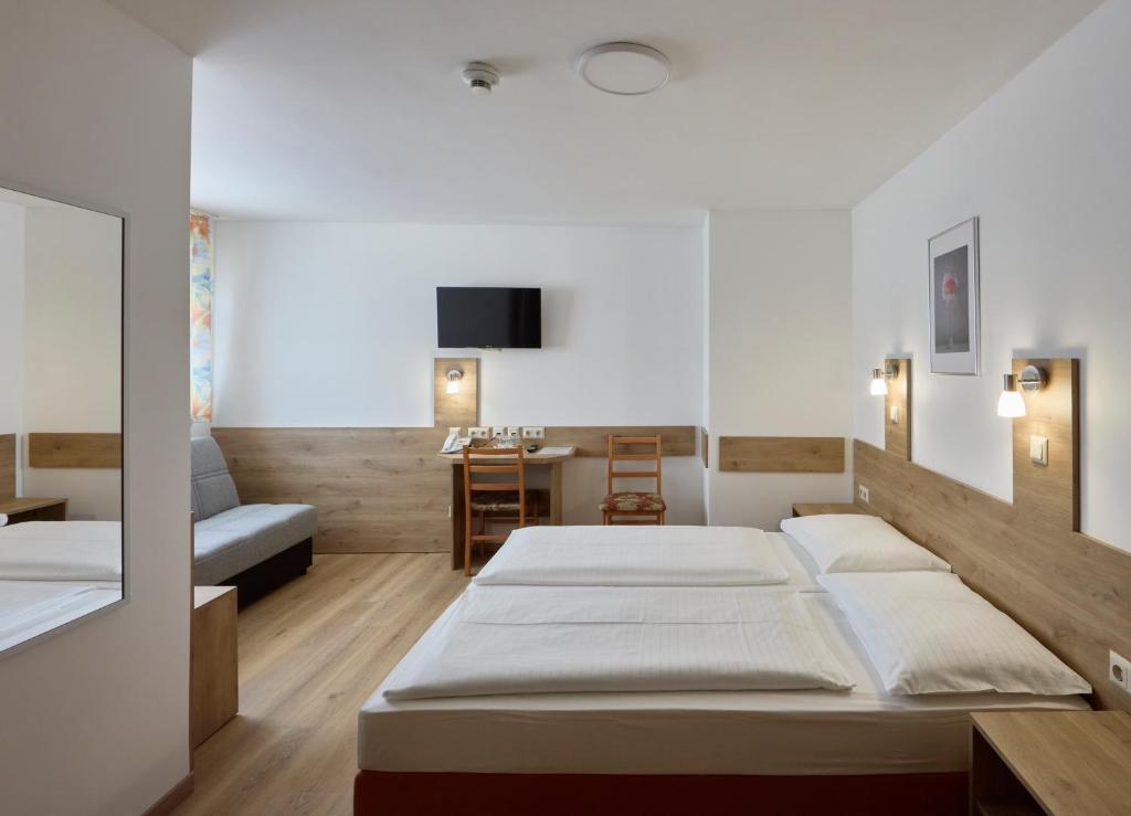 Postel nebo postele na pokoji v ubytování Hotel Terminus
