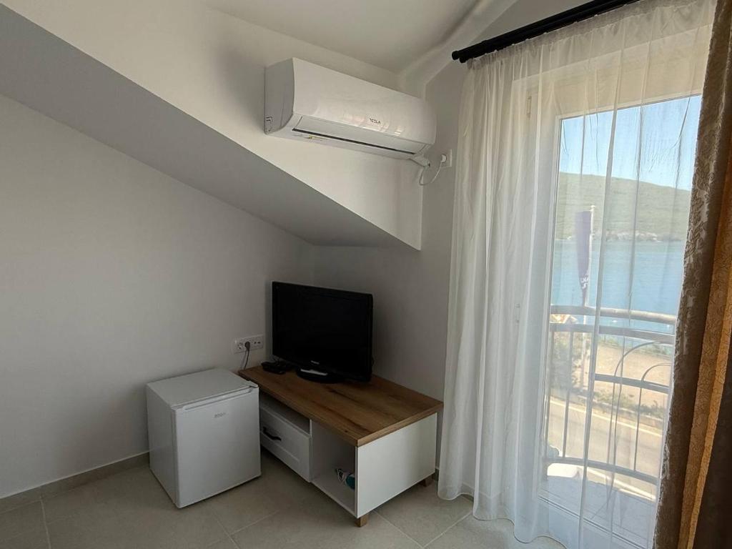TV a/nebo společenská místnost v ubytování Hotel Xanadu