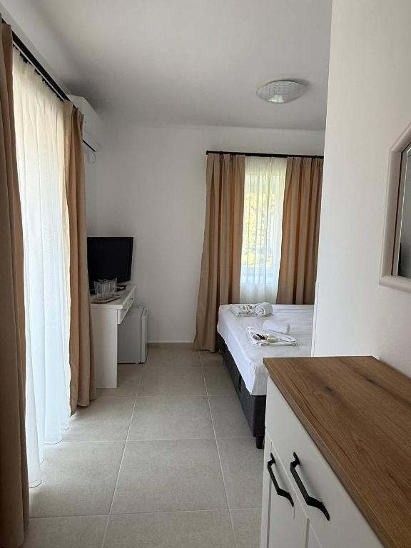 TV a/nebo společenská místnost v ubytování Hotel Xanadu