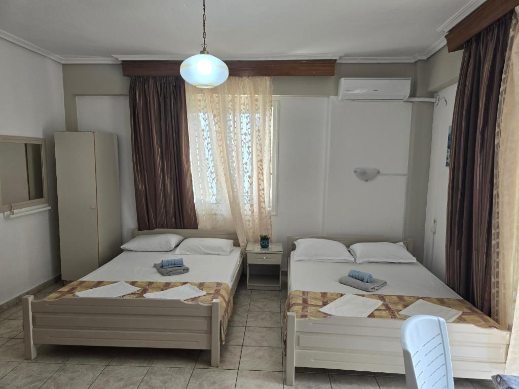 Postel nebo postele na pokoji v ubytování Niki's Rooms