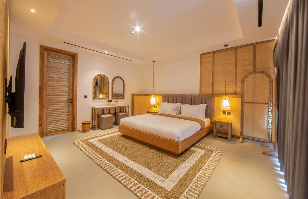 Postel nebo postele na pokoji v ubytování Suites5 Hotel