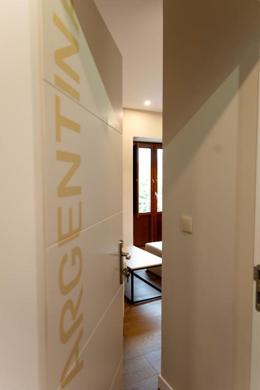 a hallway with a door leading to a living room at La Barata Apartamentos in Colombres