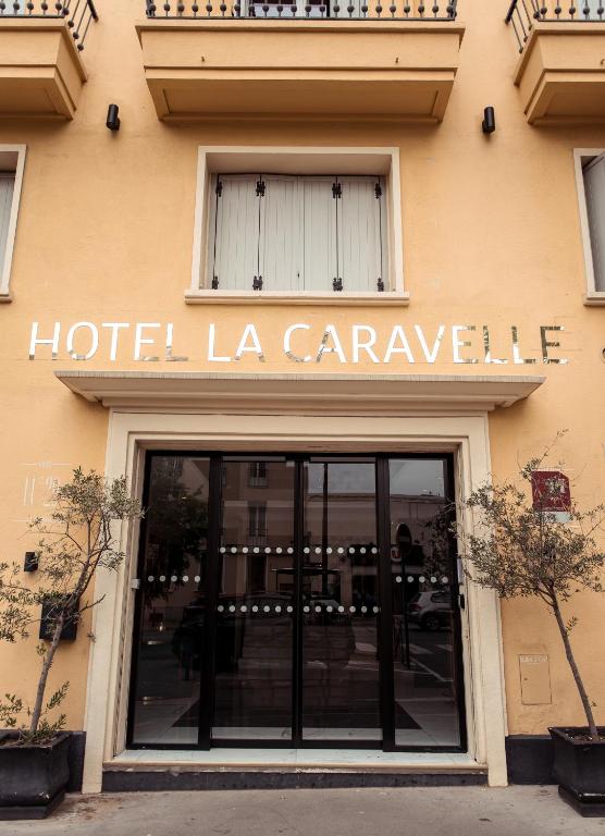 a hotel la caravle sign on the side of a building at La Caravelle in Aix-en-Provence