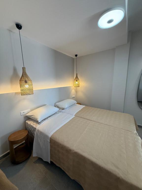 Postel nebo postele na pokoji v ubytování Panorama Rooms