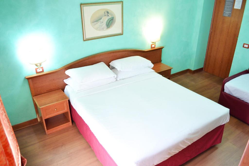 Letto o letti in una camera di Guest House Masterintrastevere