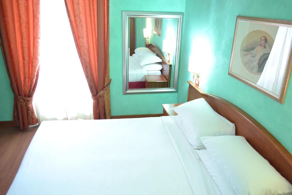 Letto o letti in una camera di Guest House Masterintrastevere