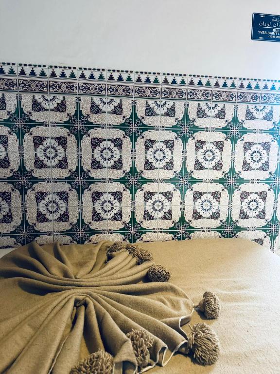 Postel nebo postele na pokoji v ubytování RIAD MAJWRIL