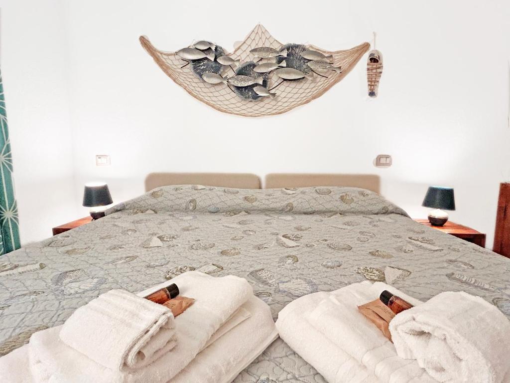 A bed or beds in a room at Deluxe Apartments in Porto Rotondo