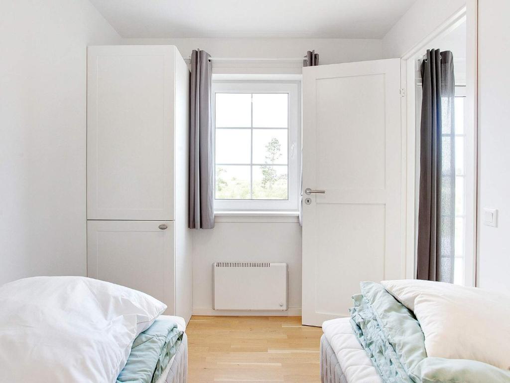 Postel nebo postele na pokoji v ubytování Læsø Seaside Holiday Homes