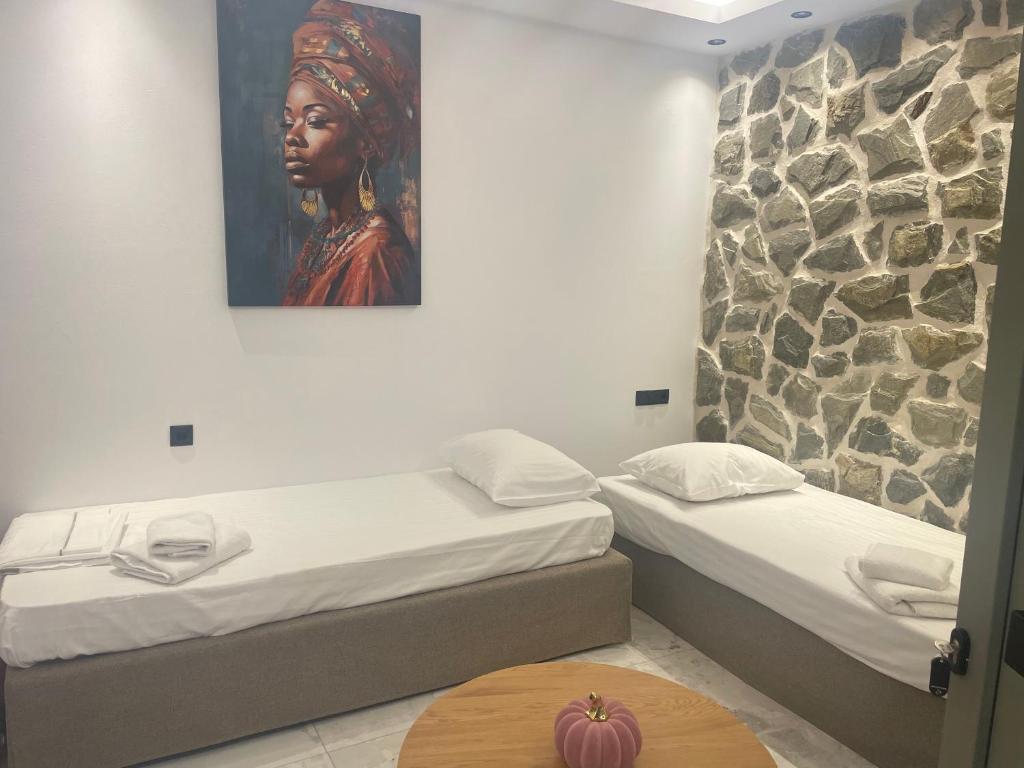 Postel nebo postele na pokoji v ubytování Latramys Suites