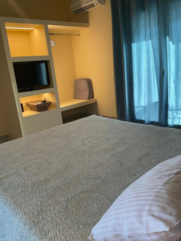 Łóżko lub łóżka w pokoju w obiekcie Maria Anastasia Studios