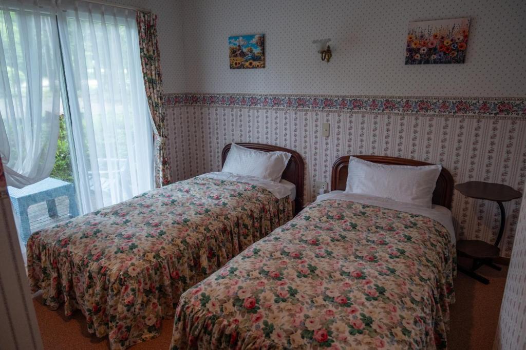 Postel nebo postele na pokoji v ubytování Pension Balmy