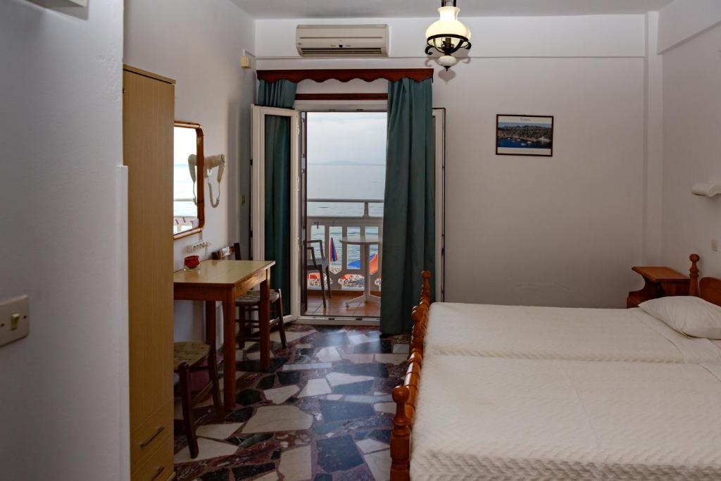 Postel nebo postele na pokoji v ubytování Lefteris Rooms