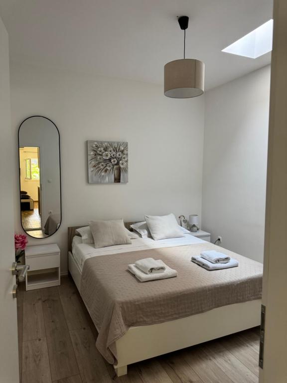 Posteľ alebo postele v izbe v ubytovaní Laganini Apartments