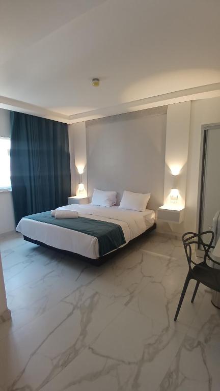 Posteľ alebo postele v izbe v ubytovaní Antonio Hotel Amman