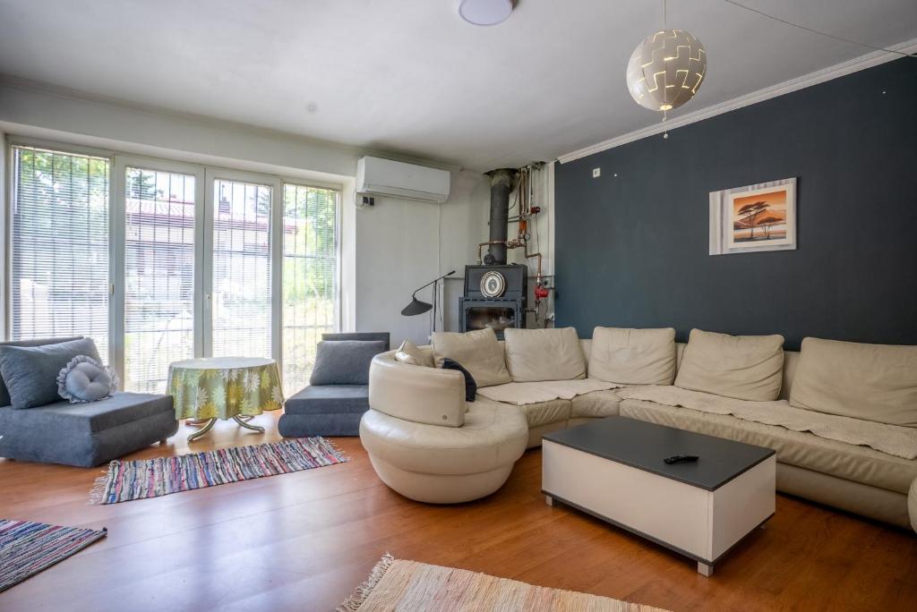 a living room with a couch and a table at Capital Stay in Sarajevo