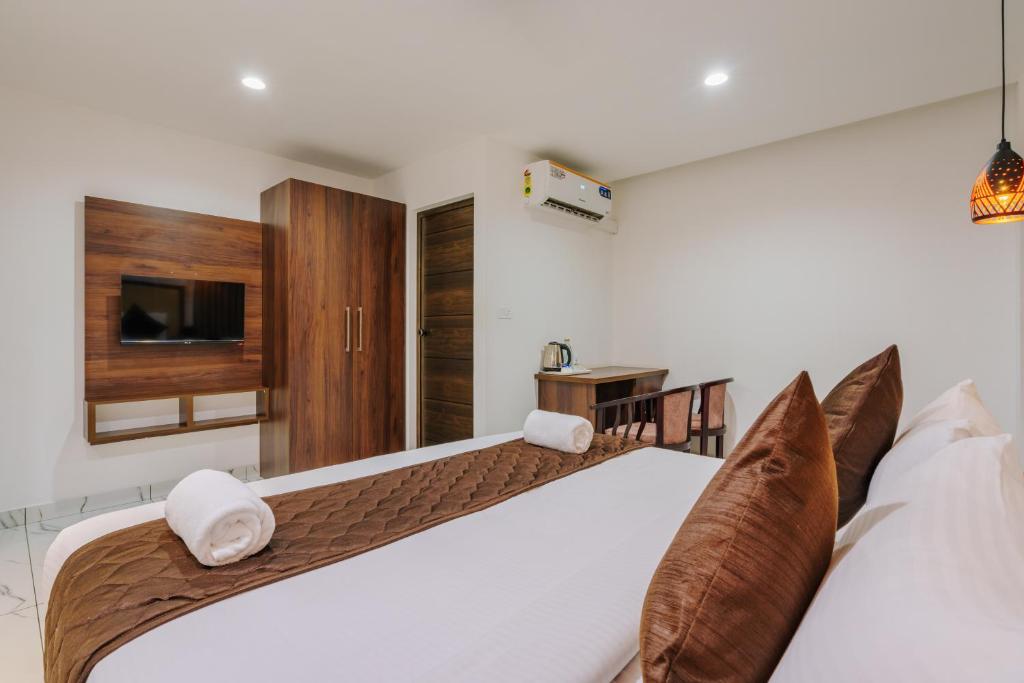 Postel nebo postele na pokoji v ubytování Mughal Suites