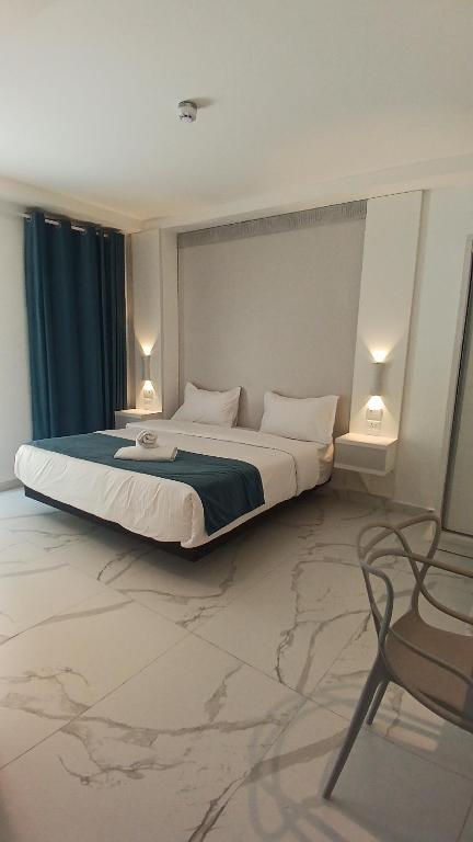 Posteľ alebo postele v izbe v ubytovaní Antonio Hotel Amman