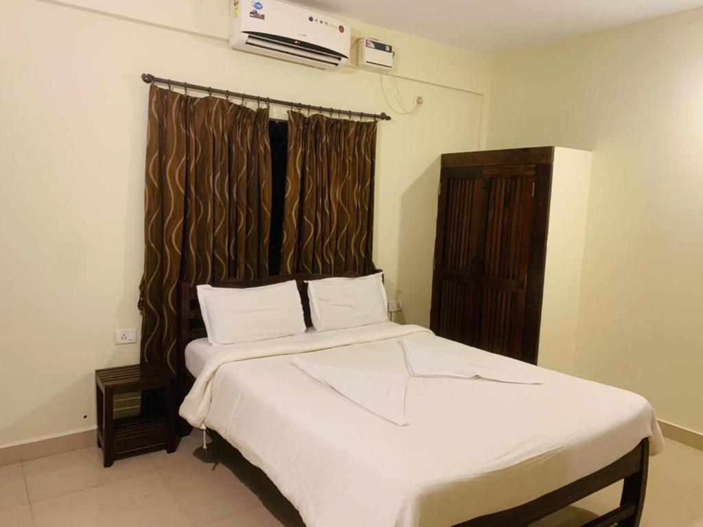Postel nebo postele na pokoji v ubytování Mehar Rooms