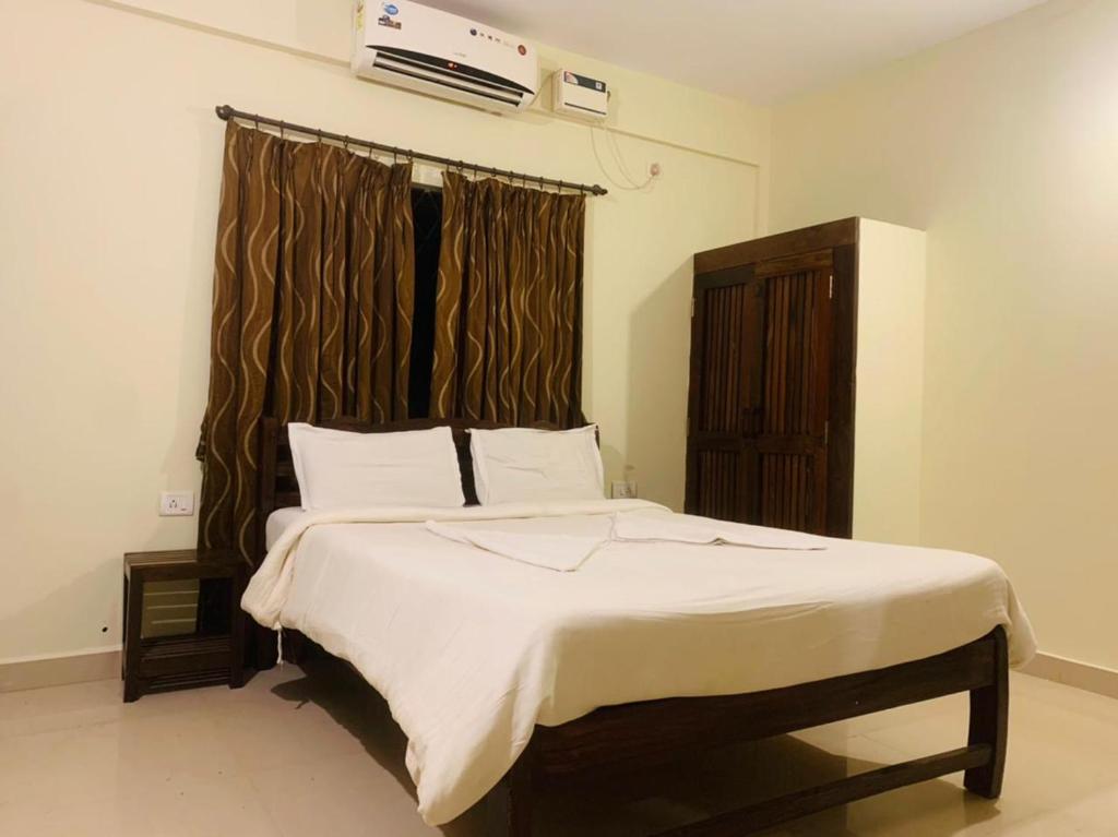 Postel nebo postele na pokoji v ubytování Mehar Rooms