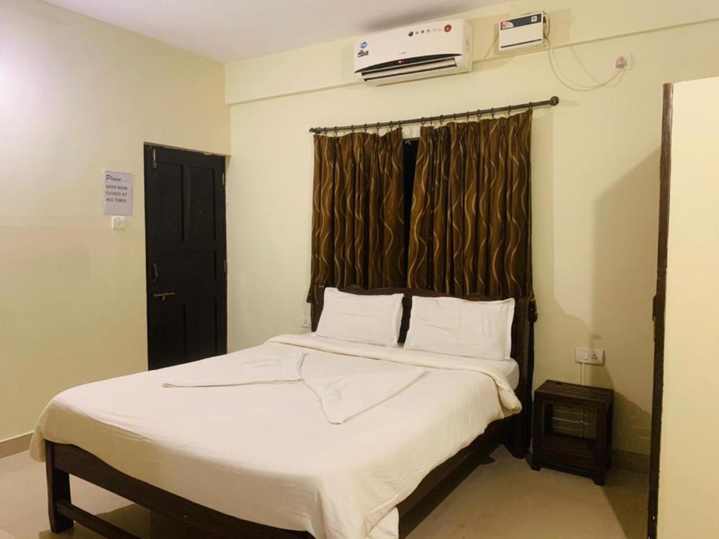 Postel nebo postele na pokoji v ubytování Mehar Rooms