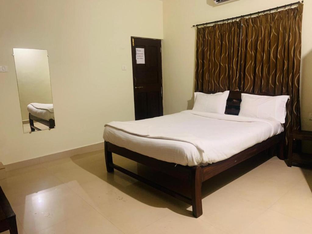 Postel nebo postele na pokoji v ubytování Mehar Rooms
