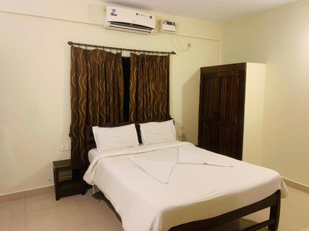 Postel nebo postele na pokoji v ubytování Mehar Rooms
