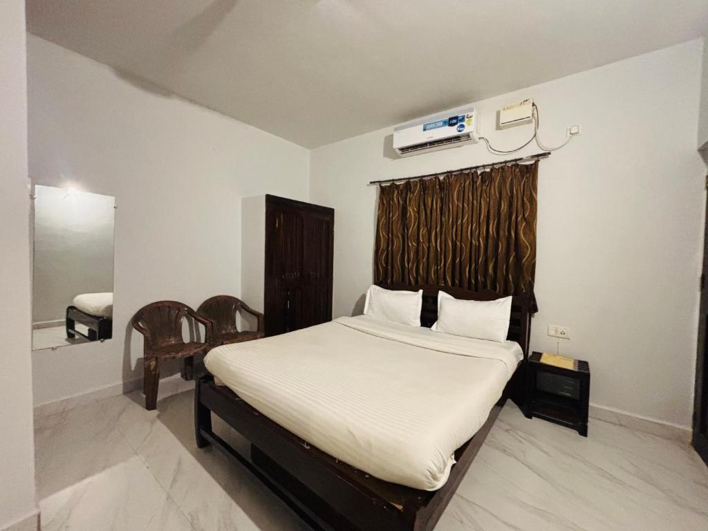 Postel nebo postele na pokoji v ubytování Mehar Rooms