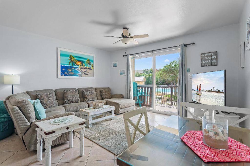 a living room with a couch and a table at Beach Resort 214 in Destin
