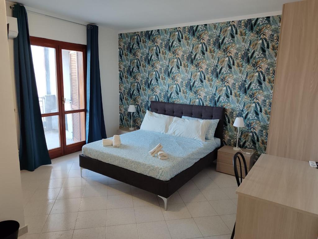 Postel nebo postele na pokoji v ubytování Guest house Sinisi